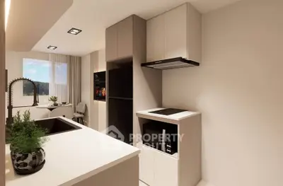 Modern kitchen with sleek design, featuring built-in appliances and open layout.