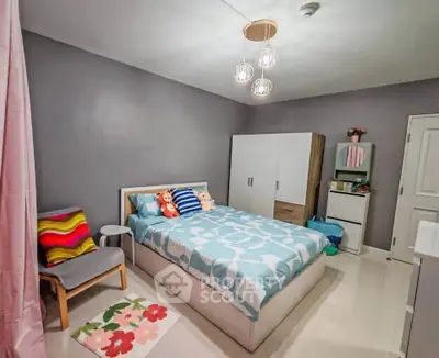 Cozy bedroom with modern decor and ample storage space, perfect for relaxation and comfort.