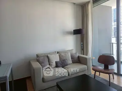 Modern living room with cozy sofa and balcony view in urban apartment