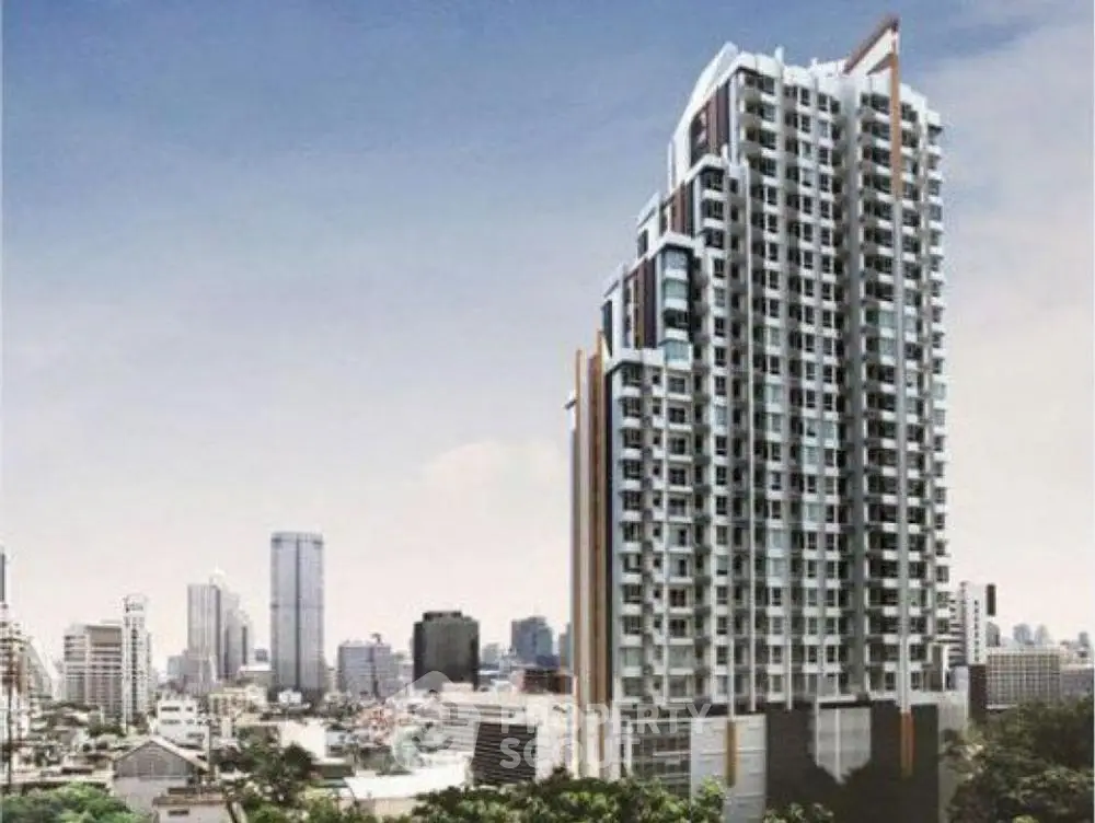 Modern high-rise building with city skyline view, ideal for urban living.