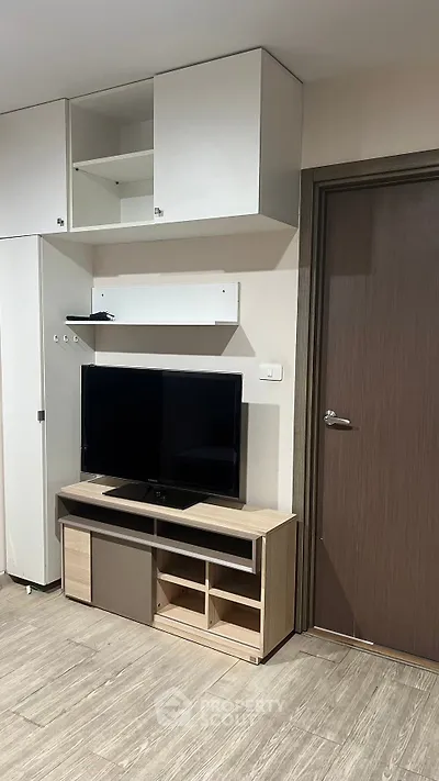 Modern living room with sleek TV stand and storage cabinets