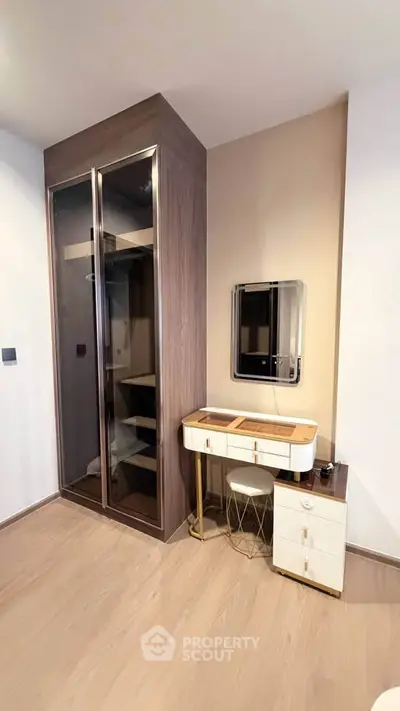 Modern bedroom with sleek wardrobe and stylish vanity set