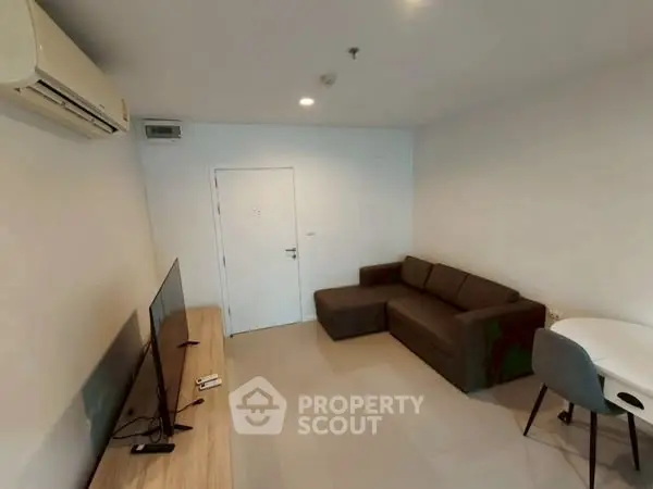 Modern living room with sleek furniture and air conditioning