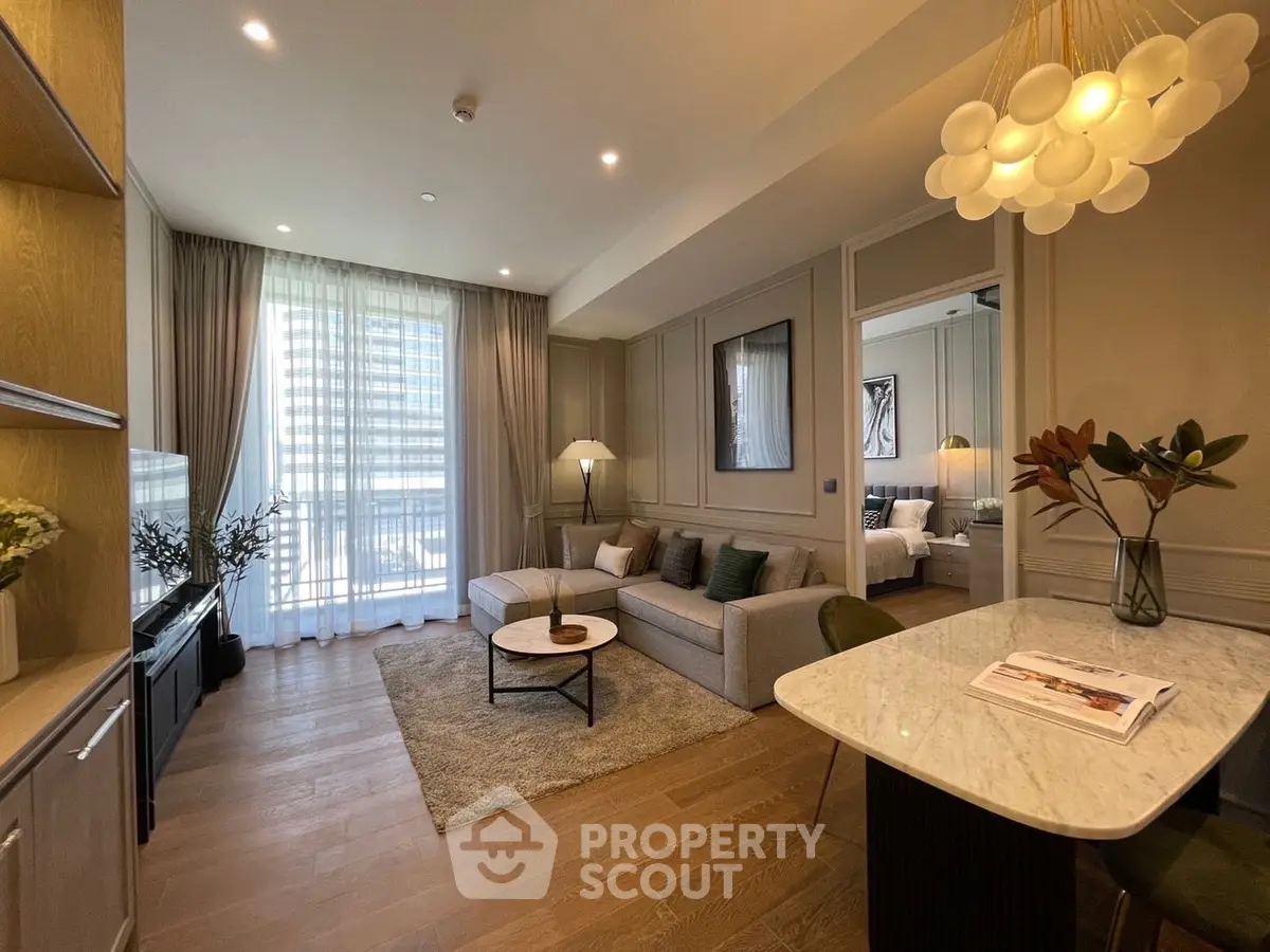Modern living room with elegant decor, cozy seating, and natural light from large windows.
