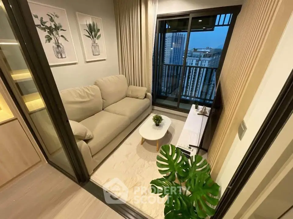 Cozy modern living room with balcony view in high-rise apartment