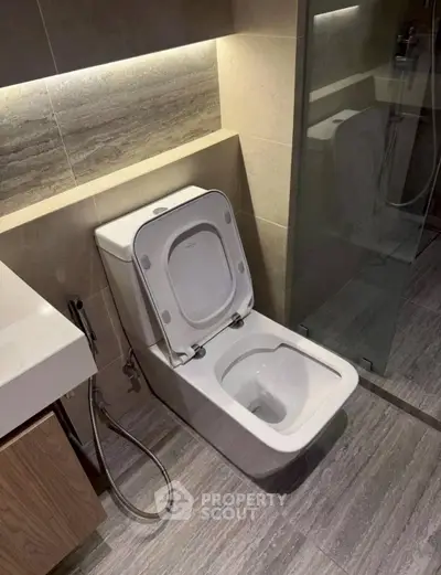 Modern bathroom with sleek toilet and elegant tile design