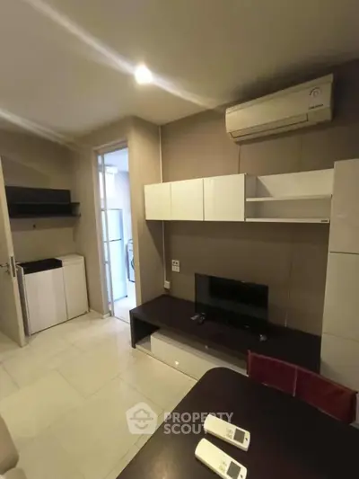 Modern living room with air conditioning and sleek furniture in a stylish apartment.