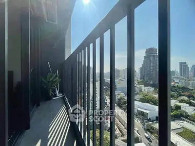 Stunning city view from modern balcony with sleek railing and sunny skyline.