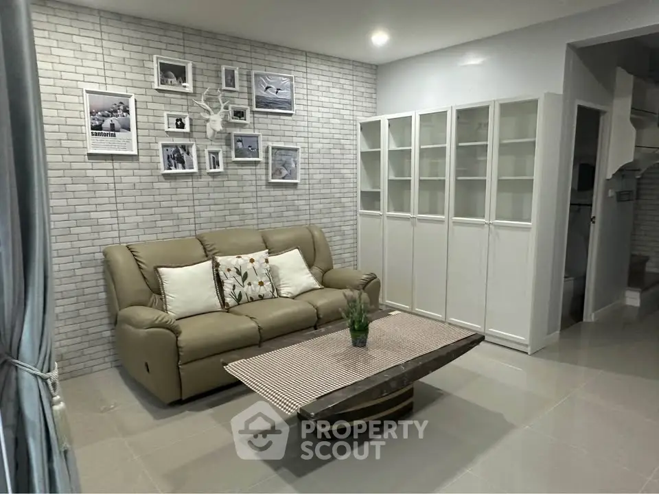 Chic living room with modern decor and cozy sofa in stylish apartment.