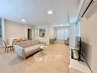 Spacious modern living room with stylish furniture and open layout, perfect for entertaining.