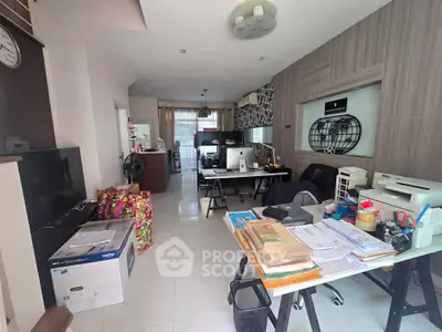 Spacious home office with modern decor and ample natural light, perfect for productivity and comfort.