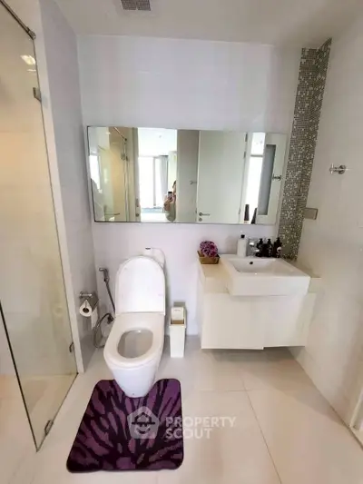 Modern bathroom with sleek fixtures and stylish decor in a contemporary home.