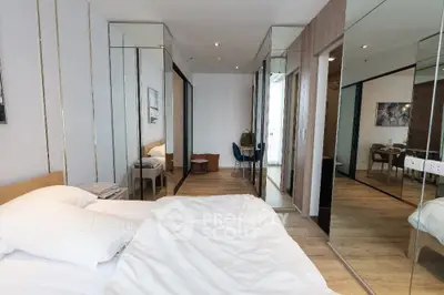 Luxurious bedroom with mirrored closets and modern decor