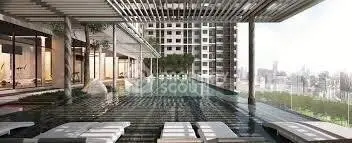 Luxurious rooftop pool with stunning city view in modern high-rise building.