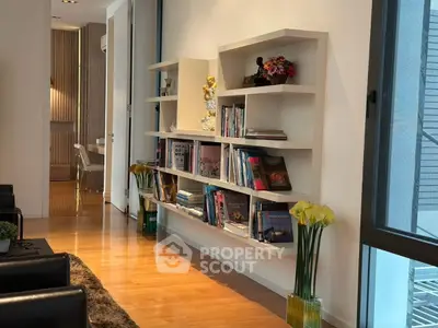 Modern living room with stylish bookshelf and elegant decor