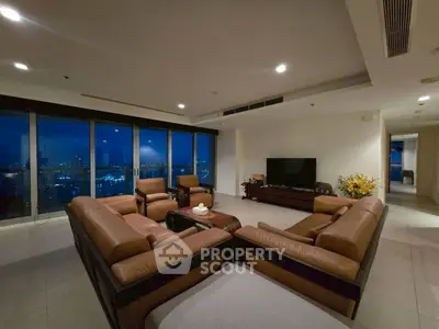Luxurious living room with city view and elegant leather sofas
