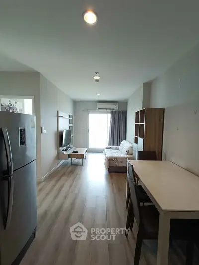 Modern living room with sleek furniture and natural light, featuring a stylish open layout and contemporary design.