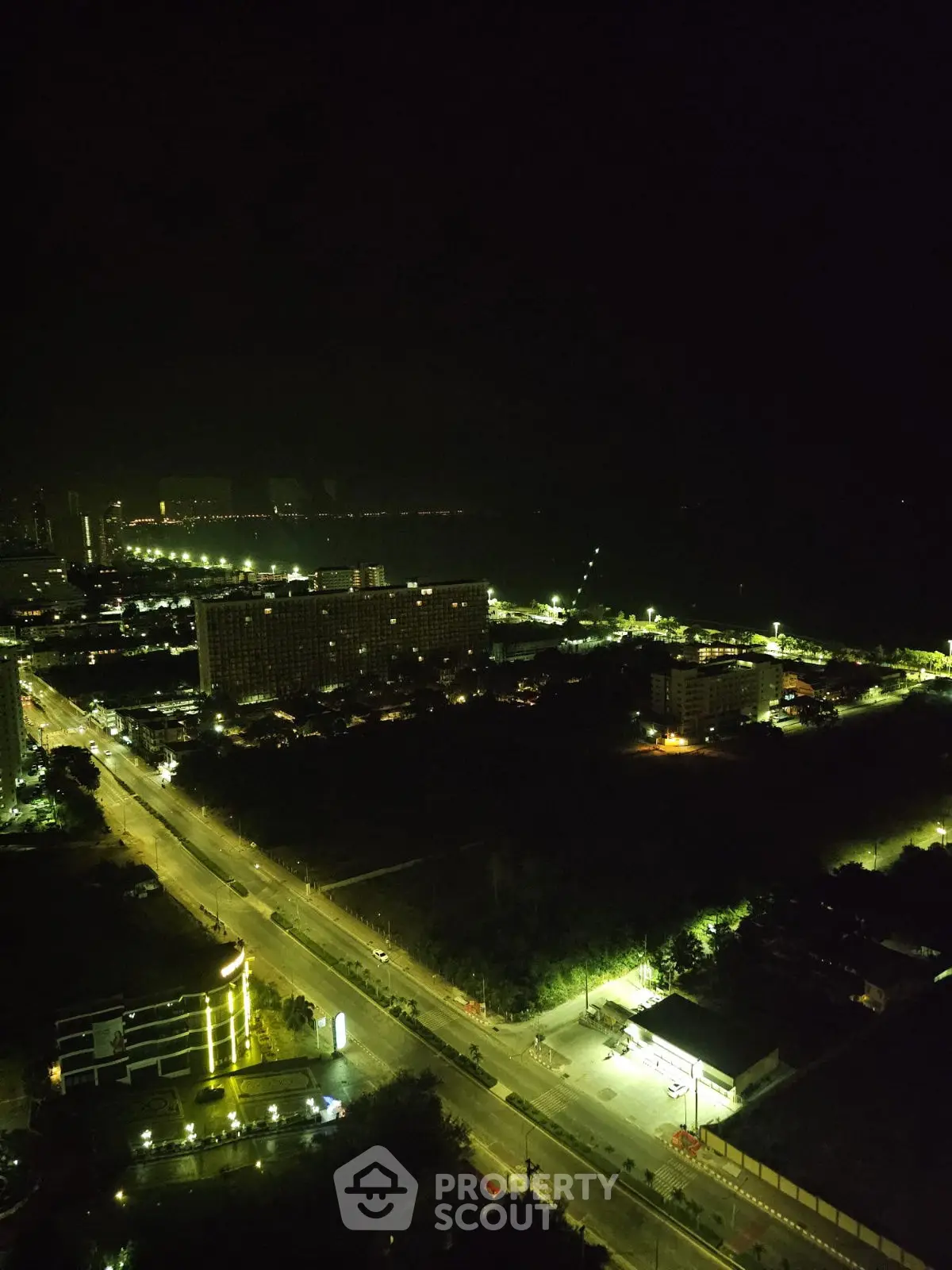 Stunning night view of cityscape with illuminated streets and buildings, perfect for urban living.