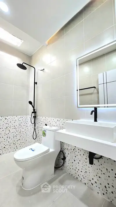 Modern bathroom with sleek fixtures and stylish tile design
