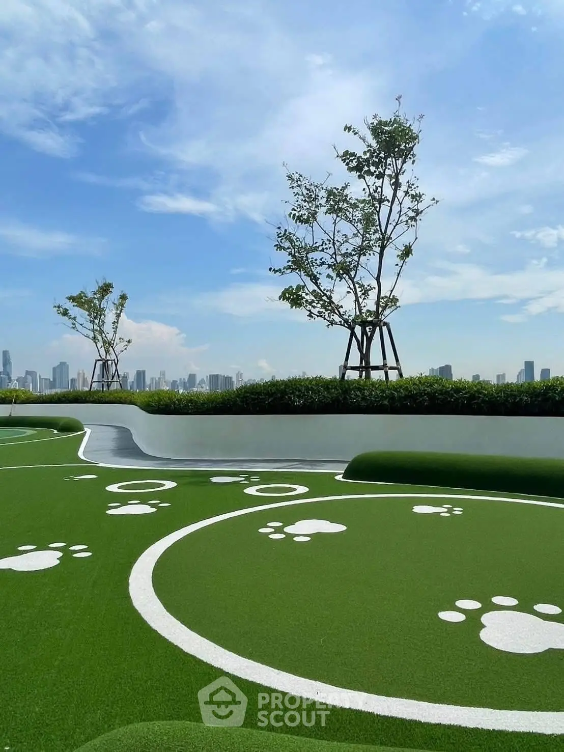 Stunning rooftop garden with city skyline views and playful paw print design.