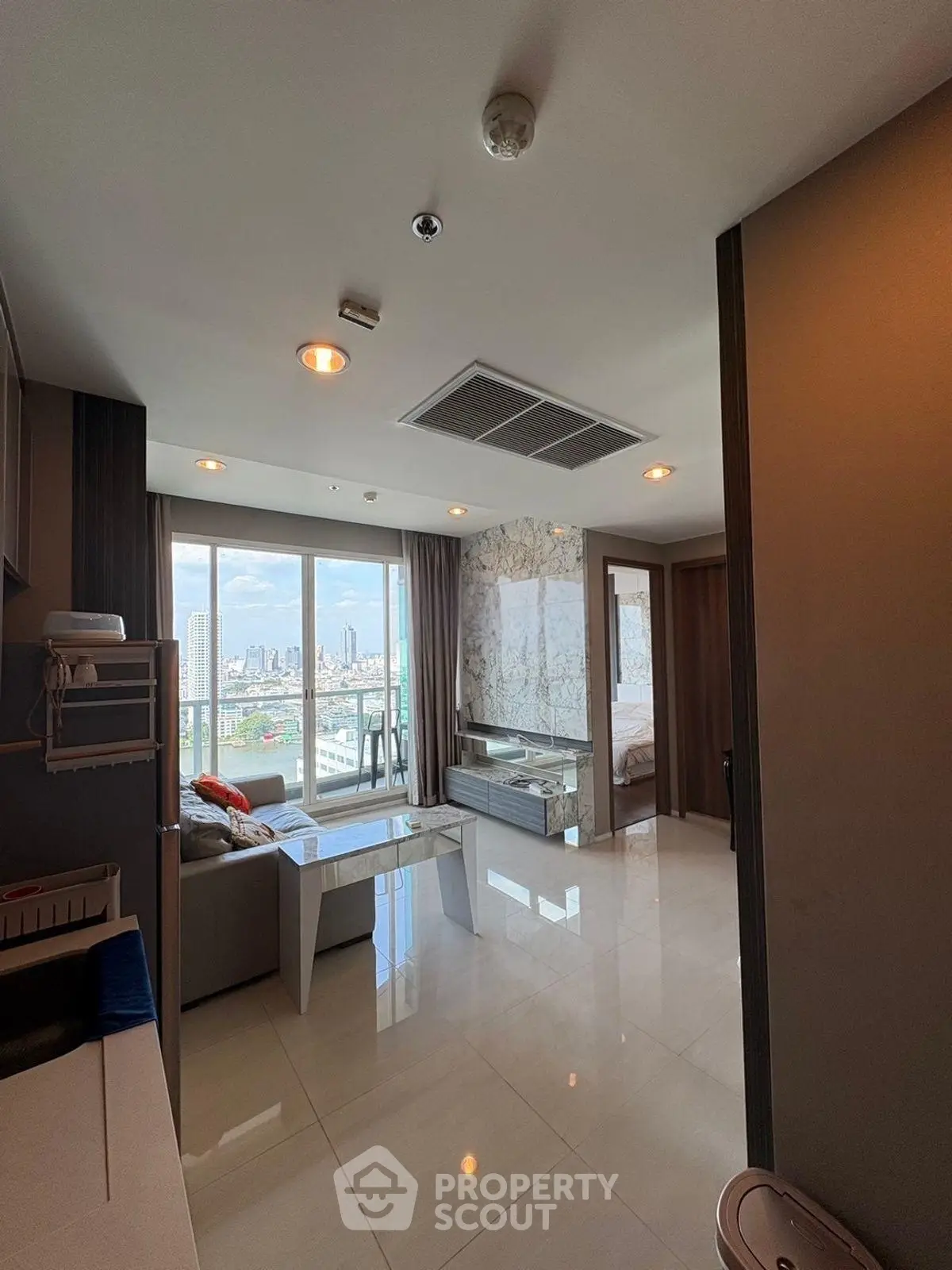 Spacious modern living room with city view and elegant decor