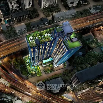Stunning aerial view of modern high-rise building with lush rooftop gardens and vibrant cityscape.