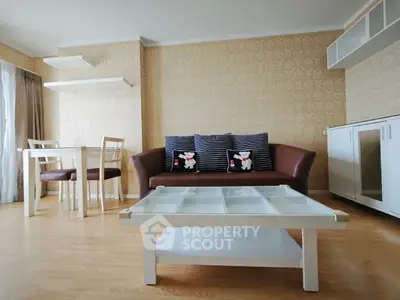 Charming living room with elegant decor and cozy seating in a modern apartment.