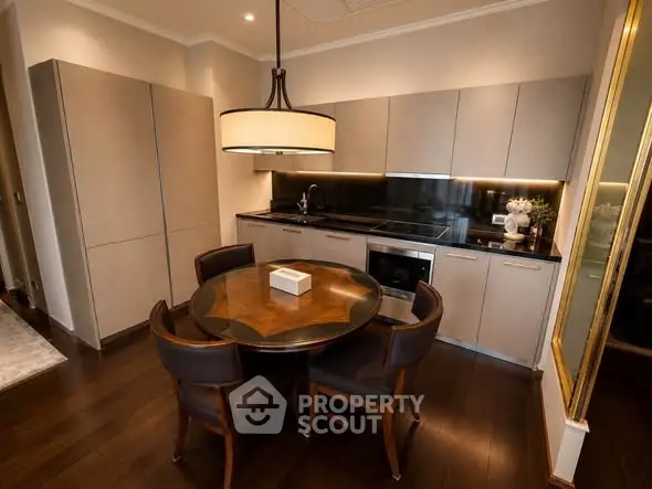 Luxurious modern kitchen with sleek cabinetry and elegant dining area