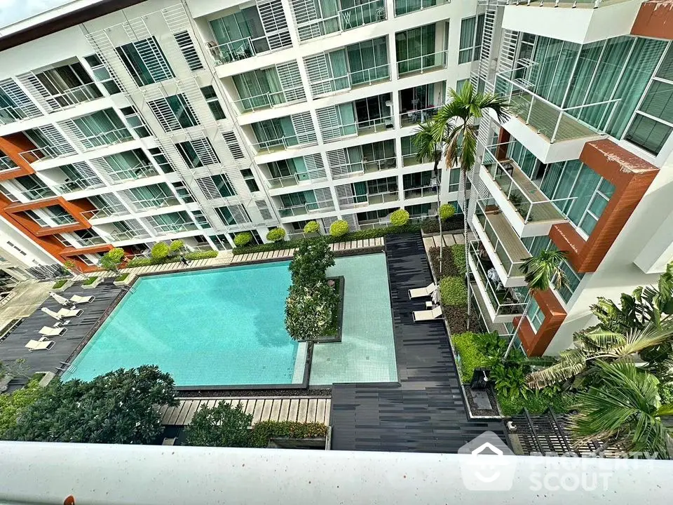 Luxurious condominium with stunning pool view and modern architecture