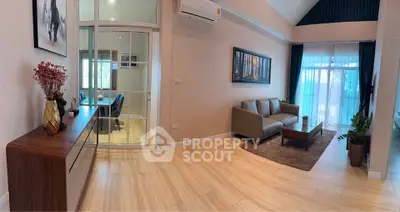 Spacious living room with modern decor and natural light