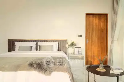 Elegant bedroom with cozy decor and natural light