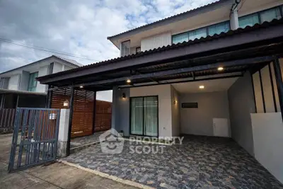 Modern two-story house with covered carport and stylish exterior design.