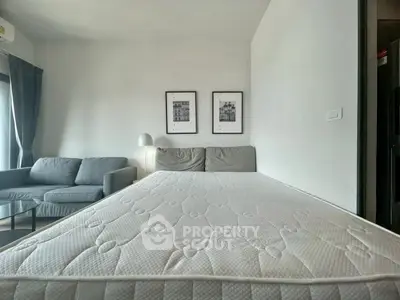 Modern bedroom with cozy sofa and stylish decor