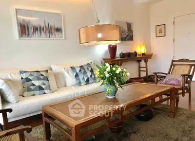 Charming living room with elegant decor and cozy seating area, perfect for relaxation and entertaining.