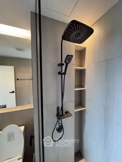Modern bathroom with sleek showerhead and minimalist design