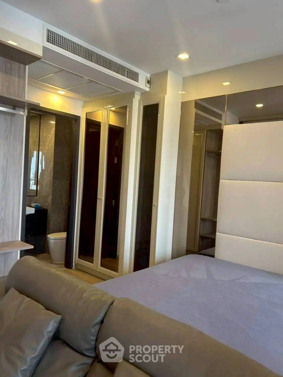 Modern bedroom with ensuite bathroom and stylish decor