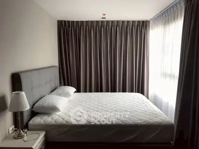 Cozy bedroom with elegant curtains and soft lighting