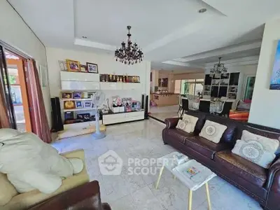 Spacious living room with elegant decor and open layout, perfect for family gatherings.