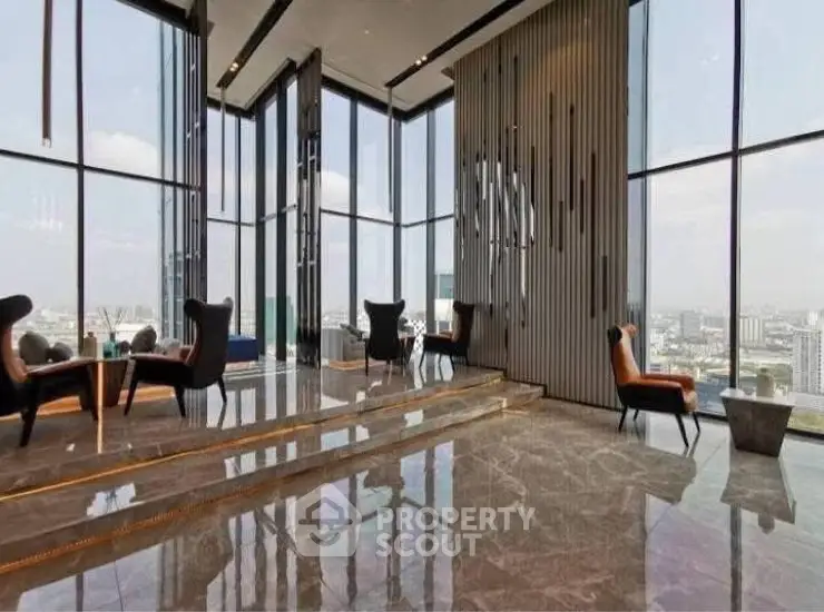 Luxurious high-rise building lobby with panoramic city views and elegant seating.