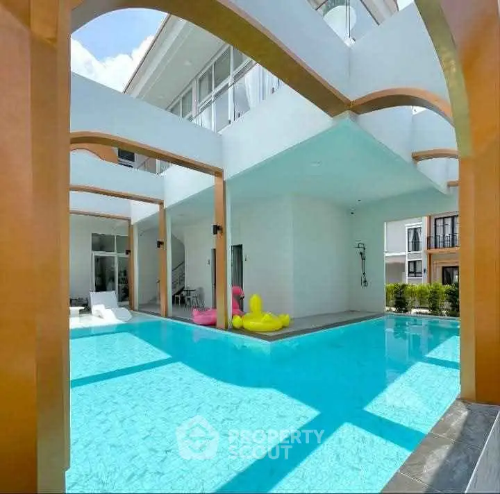 Luxurious modern villa with stunning pool and elegant architecture, perfect for relaxation and entertainment.