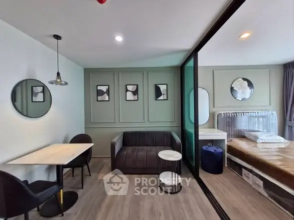 Modern studio apartment with stylish decor and glass partition