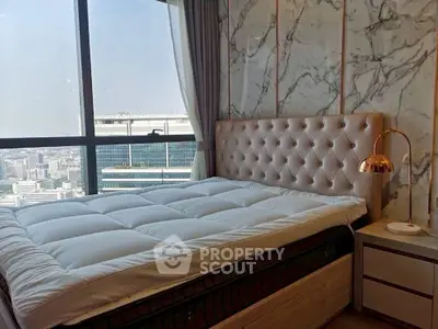 Luxurious bedroom with city view and elegant decor