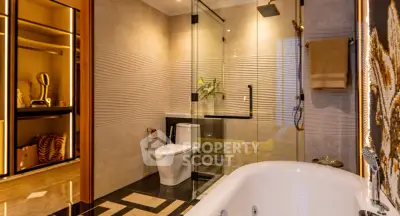 Luxurious modern bathroom with glass shower and elegant bathtub