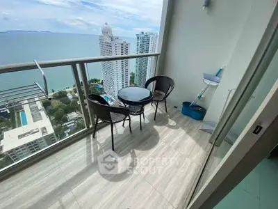 Stunning high-rise balcony with ocean view, perfect for relaxation and enjoying the scenery.
