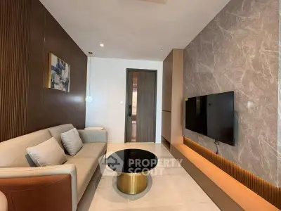 Modern living room with sleek design and wall-mounted TV