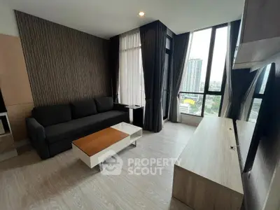 Modern living room with city view, sleek furniture, and floor-to-ceiling windows.