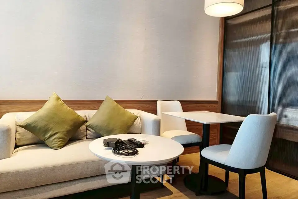 Modern living room with cozy sofa and stylish dining area, perfect for urban living.