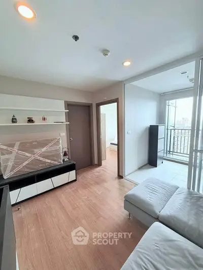 Modern living room with balcony access and stylish decor