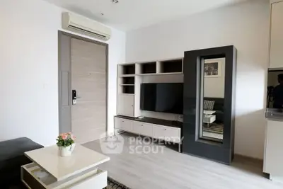Modern living room with sleek furniture and stylish decor in a contemporary apartment.