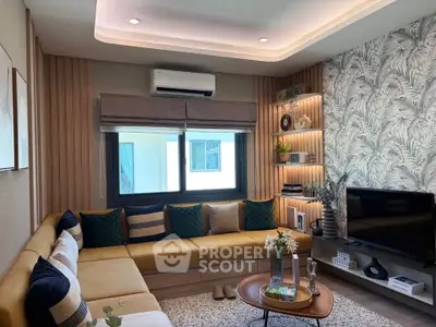 Stylish living room with modern decor, cozy sectional sofa, and elegant lighting.